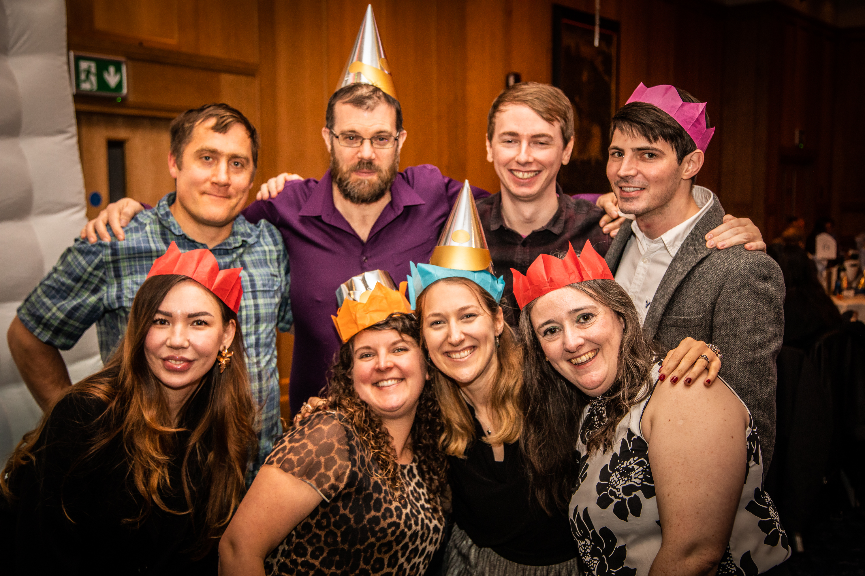 Team photo of colleagues in party hats at the Christmas Party